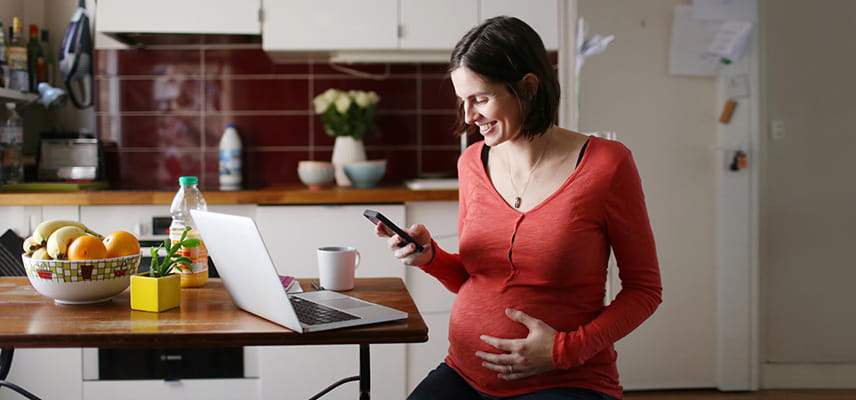 pregnant woman using phone