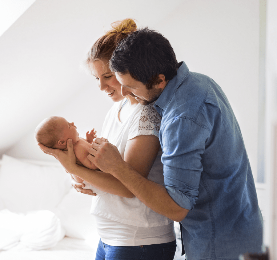 Family holding baby imagery