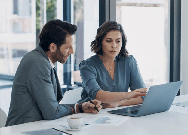 two worker looking at screen
