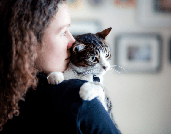 Girl with cat on shoulder