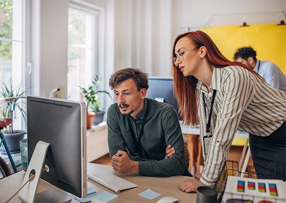 Two users viewing computer results