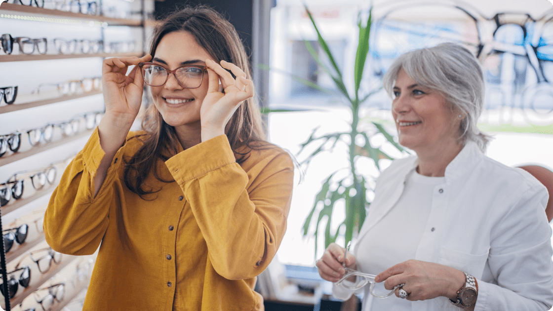 woman smiling trying glasses