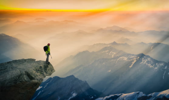 Man Overlooking Mountain Ridge