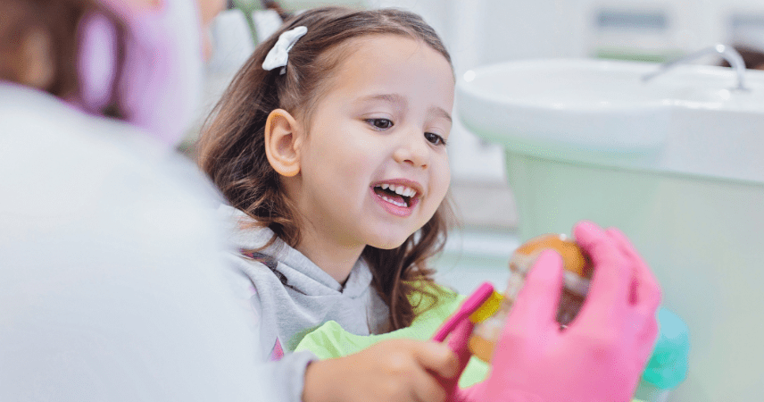 small child with toothbrush