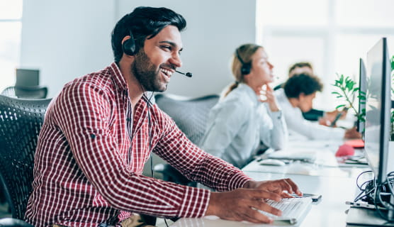 room of people on their computers and headsets